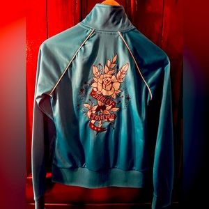 Women’s size small zip up jacket.